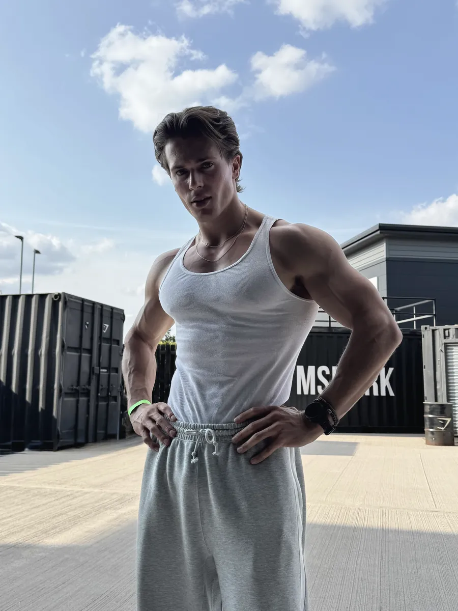 Zach Taylor outdoors in a white vest